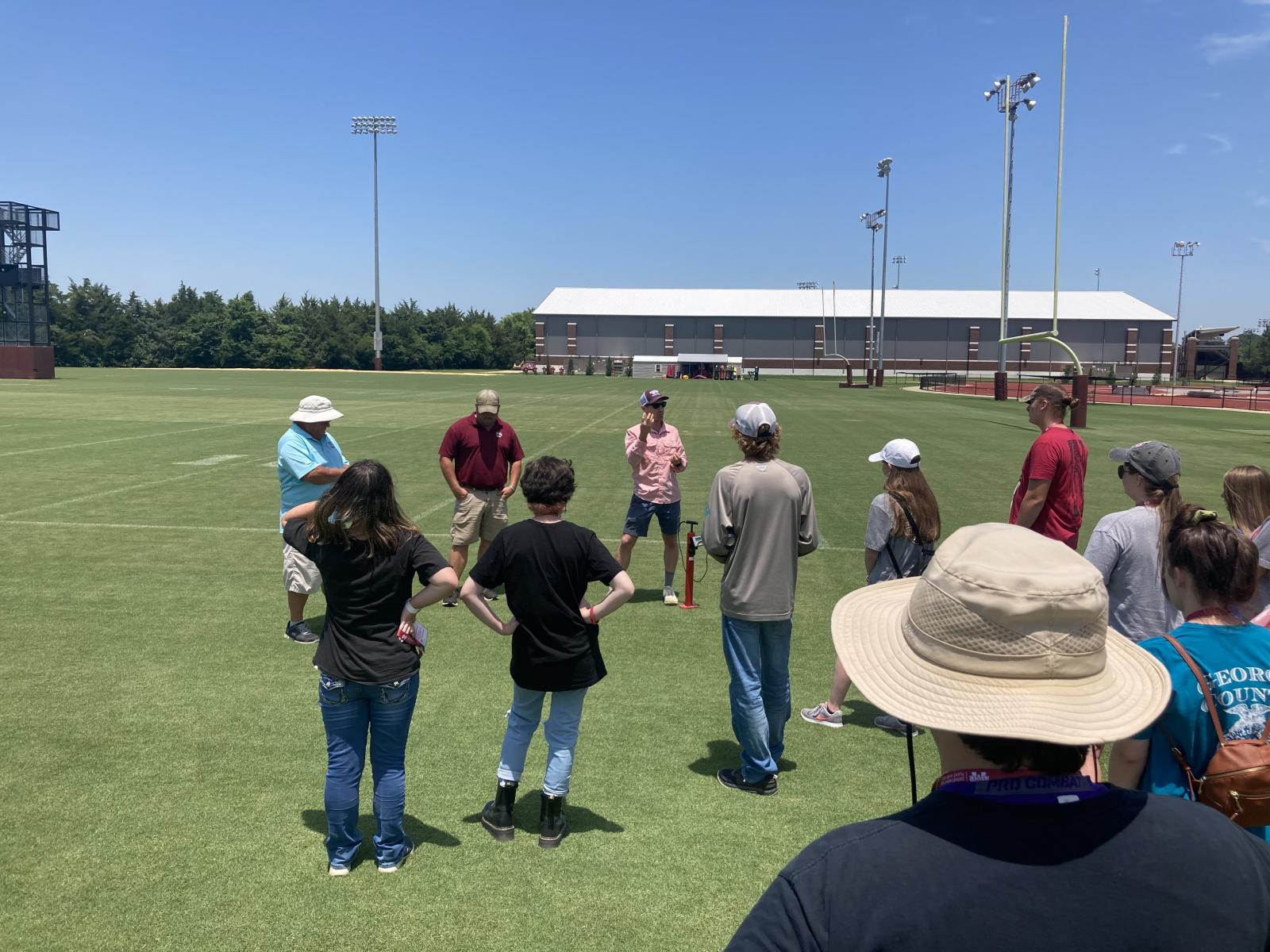 photo of students during a camp session on turf grass
