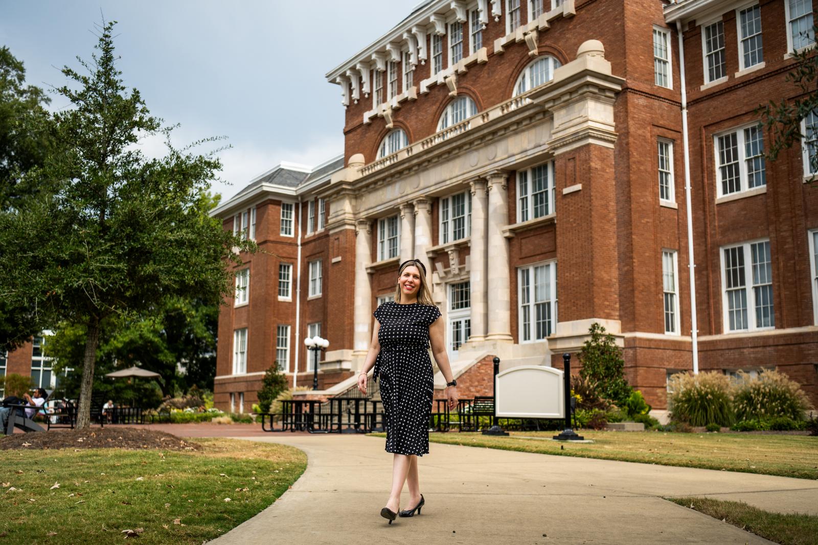 Lourdes Cardozo-Gaibisso  standing outside in front of Lee Hall