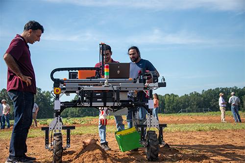 MSU Agricultural and Biological Engineering faculty and staff are working on a mechanical potato harvester.
