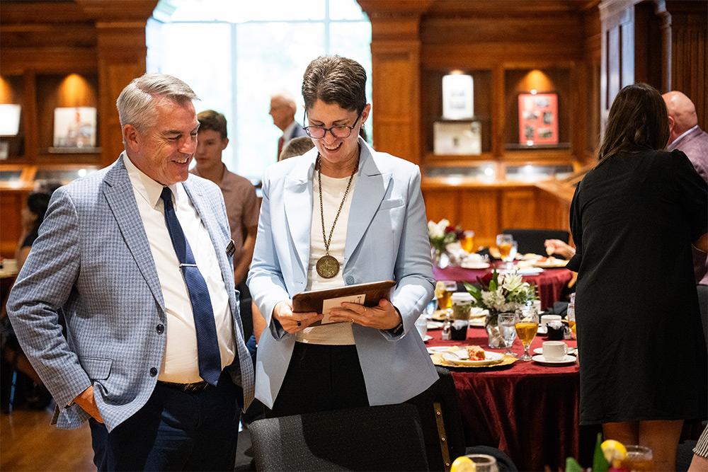 MSU Vice Provost Jim Dunne, congratulates 2026 Giles Distinguished Professor Lesley Strawderman, a professor of industrial and systems engineering, MSU’s International Paper Company Endowed Chair and associate director of the university’s Athlete Engineering Institute.