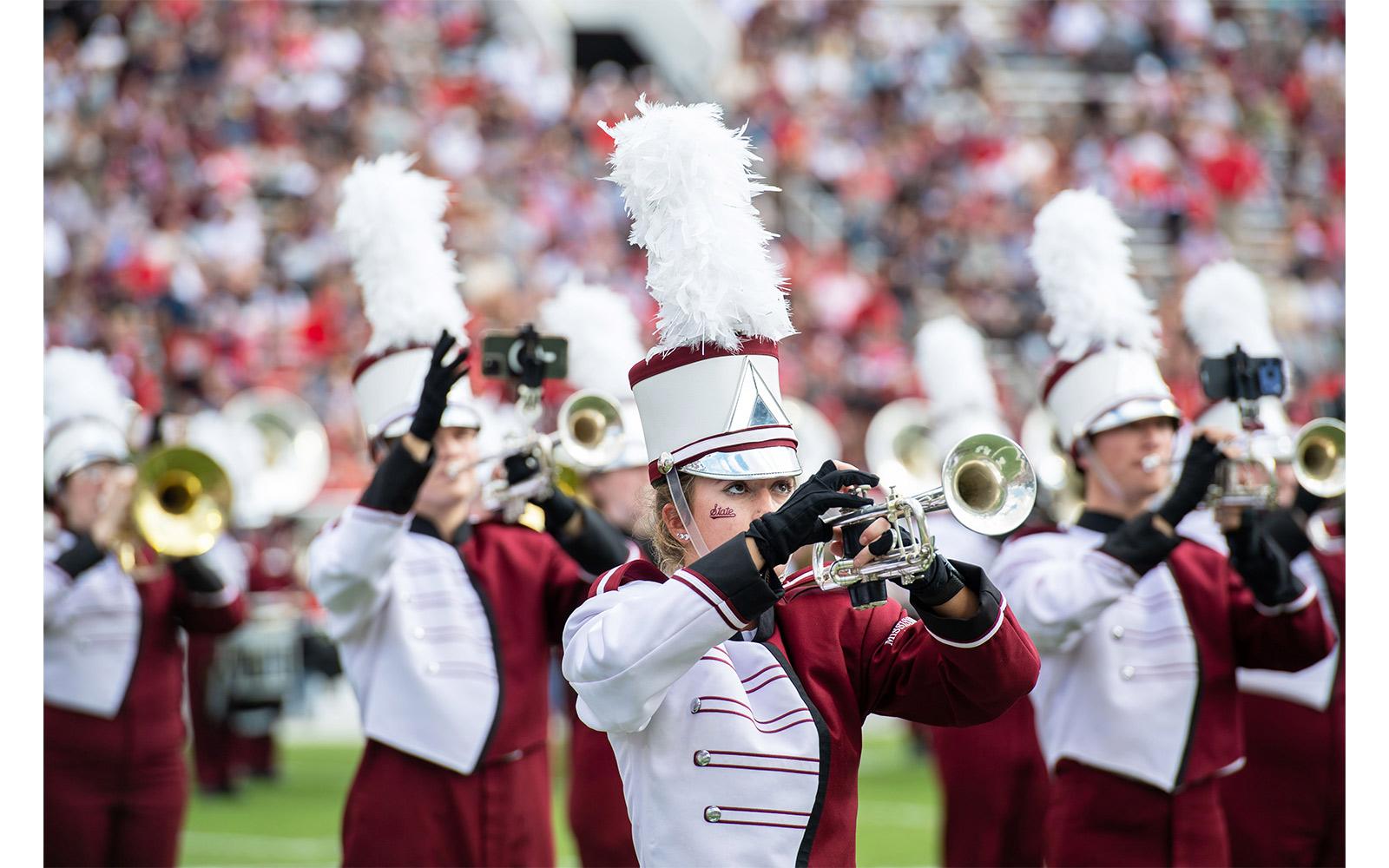 Trumpet players during a Famous Maroon Band halftime performance at Davis Wade Stadium