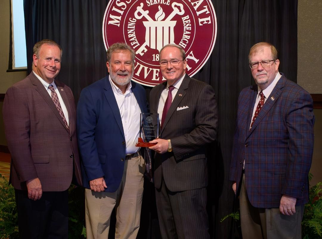 photo of MSU VPs and president with David