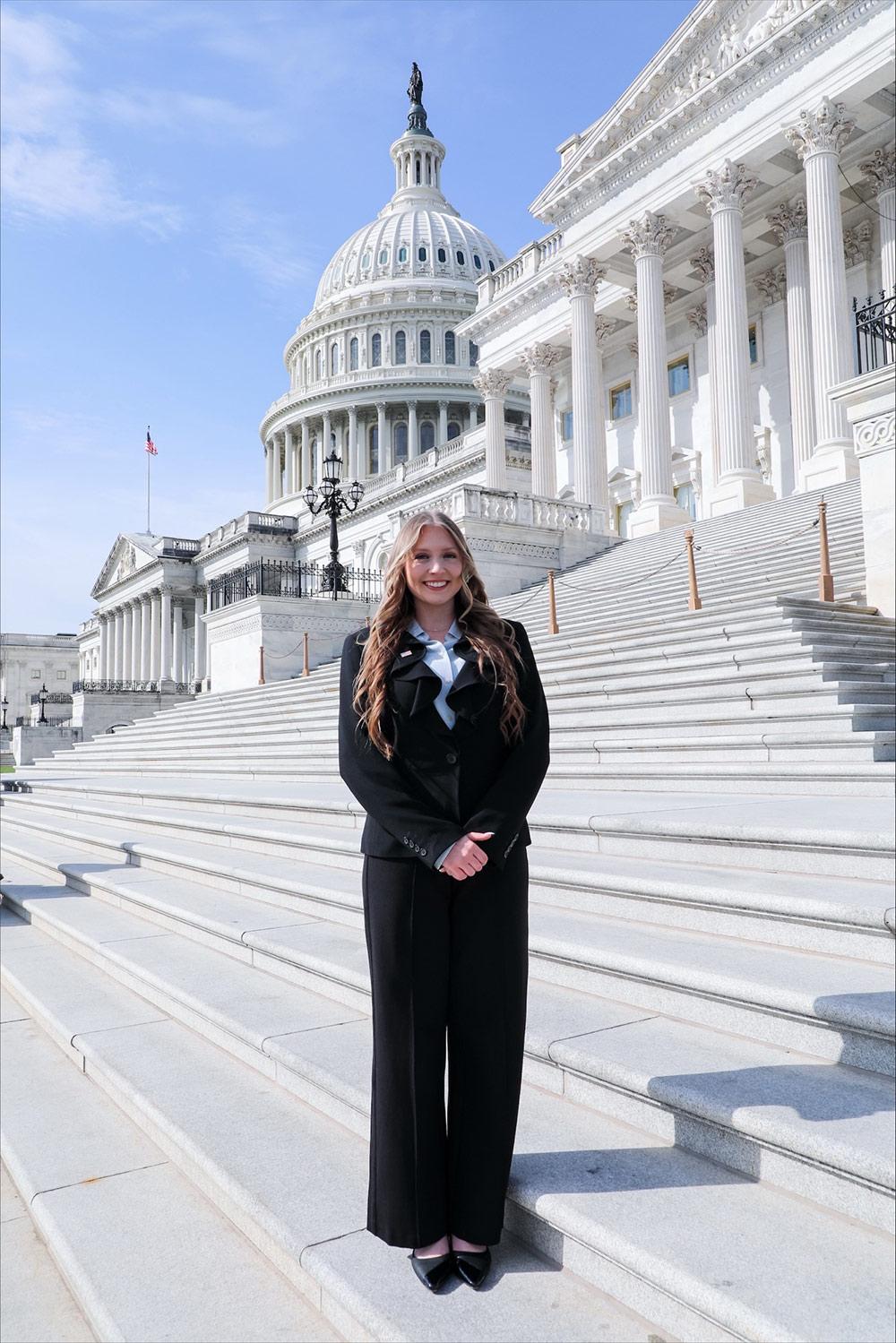 Suzanne Wells, an MSU political science senior from Houston, Texas, stands at the U.S. Capitol steps